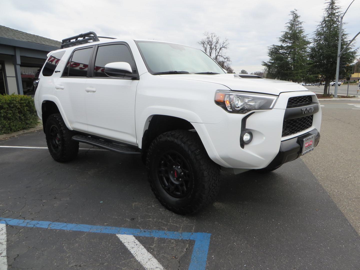 2019 White /BLACK Toyota 4Runner TRD Pro (JTEBU5JR3K5) with an 4.0L V6 engine, 5 -Speed Automatic transmission, located at 2630 Grass Valley Highway, Auburn, CA, 95603, (530) 508-5100, 38.937893, -121.095482 - Features Ironman 4X4 suspension, BFG tires, Rockslider, Roof rack, window tint, and interior Rago Fab Molle storage racks. - Photo#2